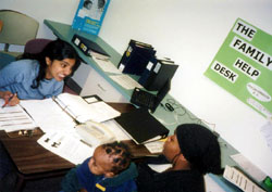 Working with a client at the Family Help Desk